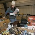 Stephanie Medrano of Bentonville sorts through donations Thursday before she fills last-minute wish ...