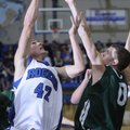 Rogers’ Graham Parker shoots over Mt. Vernon’s Zack Kleine in the first half of their Arvest Hoopfes...