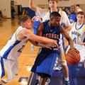 Springdale George’s Dorantez Evans, center, is guarded by Springdale Central’s Junior High’s Tucker ...