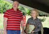 Bill and Delia Haak speak to friends, family and local officials May 12 at their home in Gentry as they accept the award for Benton County Farm Family of the Year. The Haaks were selected Friday as Arkansas Farm Family of the Year.