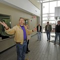 Lynn Hyke, construction manager for Fayetteville, left, leads a tour Friday of the new LEED-certifie...