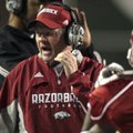 Arkansas Coach Bobby Petrino talks to his team during the third quarter of the Razorbacks' win Oct. ...