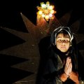 Janet Sala represents the Virgin Mary during a procession and celebration Friday of the story of Mar...