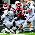 Arkansas defensive end Tenarius Wright forces Texas A&M quarterback Jerrod Johnson to fumble the bal...
