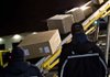 Packages roll off a FedEx cargo jet at Memphis on Friday.