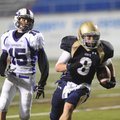 Shiloh Christian junior defensive back Zann Jones 
runs after making an interception as Lonoke juni...