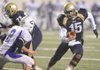 Shiloh Christian junior quarterback Kiehl Frazier carries the ball as Lonoke senior defender Brandon O’Brannon closes in on the play during the first half of the Class 4A State Championship game Saturday in War Memorial Stadium in Little Rock.