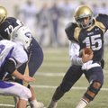 Shiloh Christian junior quarterback Kiehl Frazier carries the ball as Lonoke senior defender Brandon...
