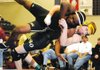 Bentonville’s Jason Bruno, right, takes Little Rock Central’s Marcus Williams to the mat during their 160-pound match Saturday at the Rogers Heritage War Eagle Duals in Rogers. Bruno won the match with a pin.