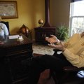 Ralf Humbert talks Dec. 1 about the services offered by Trump Tours as Tiffiny Humbert looks on at t...