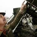 Mark Willhite talks Saturday about the damage done to one of his buildings at Willhite’s Forest Prod...