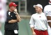 Arkansas offensive coordinator Paul Petrino, right, left the Razorbacks and brother Bobby Petrino, left, to become the offensive coordinator at Illinois on Dec. 14.