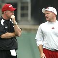 Arkansas offensive coordinator Paul Petrino, right, left the Razorbacks and brother Bobby Petrino, l...