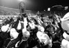 Shiloh Christian players celebrate the Saints’ 56-20 win over Lonoke in the Class 4A state championship Saturday in War Memorial Stadium in Little Rock.