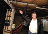 Calvin Yockey shows the inner workings of his geothermal system in his Fayetteville house.