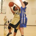 Bentonville’s Rashaun Casey goes up for a shot against Springdale Central’s Morgan Stephens on Monda...