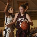 Lincoln’s Rashelle Goldman drives to the basket as West Fork’s Melissa Jones defends during Monday’s...