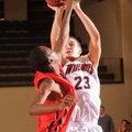 Rogers Heritage’s Austin Heard, right, takes a shot over Ramay’s Tré Boyd during the third quarter o...