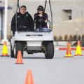 Rogers High School student Heather Gatton, 16, drives a golf cart Monday wearing “drunk goggles” wit...