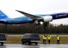 Employees at Paine Field in Everett, Wash., cheer as a Boeing 787 Dreamliner takes off for its first test flight Tuesday.