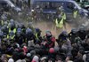 Danish riot police pushes back protestors during a demonstration outside the Bella Center, the venue of the U.N. Climate Conference, in Copenhagen Wednesday.