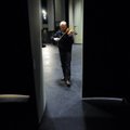 Violinist Mateusz Jedrysek exits the stage following a warm-up session Tuesday for members of the Si...