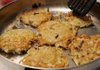 Members of Congregation Etz Chaim in Bentonville fry pans of potato latkes on Friday for their Pot Latke dinner to celebrate the first day of Hanukkah. 