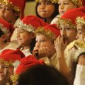 Second-graders at Owl Creek School wait Tuesday for the start of their Christmas Musical in Fayettev...