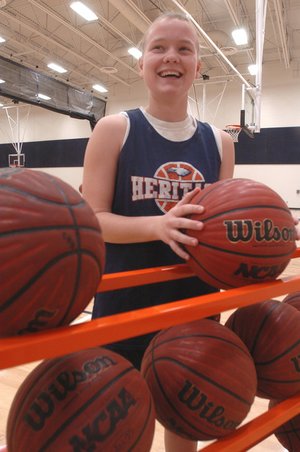 Lindsey Wood is handling the basketball more and scoring more points for Rogers Heritage.