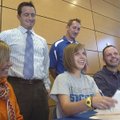 Rogers Heritage’s Kinsey Morris, seated, center, signed a letter of intent to play soccer for Centra...