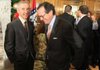 Frank O’Mara (left), chief executive officer of Allied Wireless, greets Warren Stephens on Tuesday at the state Capitol. Stephens’ company played a role in Allied’s choosing Little Rock, state officials said. 