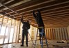 Workers install a heating system Wednesday in a new home in Barre, Vt. Construction of new homes rebounded in November from an October setback, the Commerce Department reported.