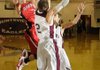 Farmington’s Evan Yochum takes a jump shot over a pair of Huntsville defenders Tuesday.