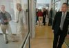 University of Arkansas Chancellor G. David Gearhart (right) tours the new KUAF radio station headquarters at South School Avenue and West Mountain Street in Fayetteville on Wednesday during an open house.