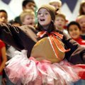 House call Second-grader Kennedy House, 8, performs Wednesday at Westside Elementary School in Roger...