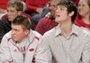 Arkansas’ Rotnei Clarke (left) and Michael Sanchez watched the Razorbacks’ 76-51 victory over Alabama State on Wednesday night. UA players have missed a combined 30 games this year. 