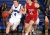 Rogers’ Branden Gentz, left, drives past Webb City’s Austin Daniel on Saturday during the championship game of the Arvest Hoopfest Classic at Rogers High.