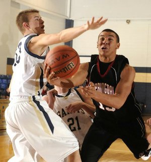 Springdale High sophomore Tony Dennis, right, shoots around Shilloh Christian sophomore Taylor Thompson in the third quarter Thursday in Springdale.