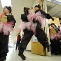 Kenney House, 8, center, left, and Anna Kieffer, 7, do a “bear belly bump” Thursday while waiting wi...