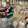 Essa Hicks, volunteer with the Salvation Army, loads a bike into a cart to deliver Thursday to a fam...