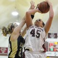 Springdale High’s Tiffany Wiseley, right, shoots over Alma’s Brittany Marrs in the second half of th...