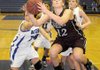 Siloam Springs forward Anna Markovich grabs her own rebound after a failed shot against Rogers High in Rogers on Friday.