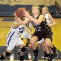 Siloam Springs forward Anna Markovich grabs her own rebound after a failed shot against Rogers High ...