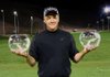 North Little Rock native Bobby Wilson proudly displays his two trophies from the 2009 RE/MAX World Long Drive Championship in Mesquite, Nev.
