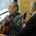 Jeremy Hess, left, and Rabbi Jacob Adler sing a prayer for peace with the crowd gathered for the ded...