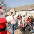 SANTA SIGHTING
Santa greets students, staff and teachers Friday at Garfield Elementary School. Sant...