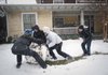 Some 13-year-olds in Asheville, N.C., play in the snow Friday during the area’s first major winter storm of the year.