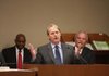 With Artee Williams (left) and Bruce Waller, both with the Department of Workforce Services, behind him Friday, department official Ron Calkins addresses the Legislative Council in Little Rock.
