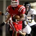 Farmington’s Jared Martin tries to break free from a Prairie Grove tackler during the first quarter ...