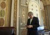 Sen. Ben Nelson, D-Neb., checks his BlackBerry in the Senate Reception Room on Saturday after deciding to support the healthcare overhaul bill. 